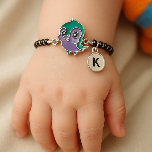 Bird charm paired with classic black beads for protection 🧿